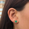 Yellow gold round emerald studs with diamond jackets