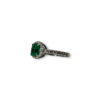 Step cut emerald in quirky round setting