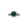 Step cut emerald in quirky round setting