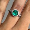 Step cut emerald in quirky round setting
