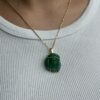 Carved emerald Jesus pendant