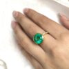 Big round bezel set Colombian emerald ring