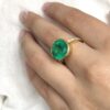 Big round bezel set Colombian emerald ring