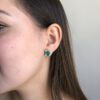 Art deco inspired Colombian emerald studs with detachable diamond jackets