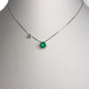 Elegant emerald and diamond solitaire necklace