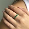 Half eternity emerald ring