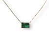 Trilogy of baguette cut emerald pendant