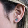 Emerald and shapphire halo studs