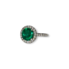 Round brilliant Colombian emerald with diamond halo