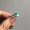 Classic Colombian emerald halo ring