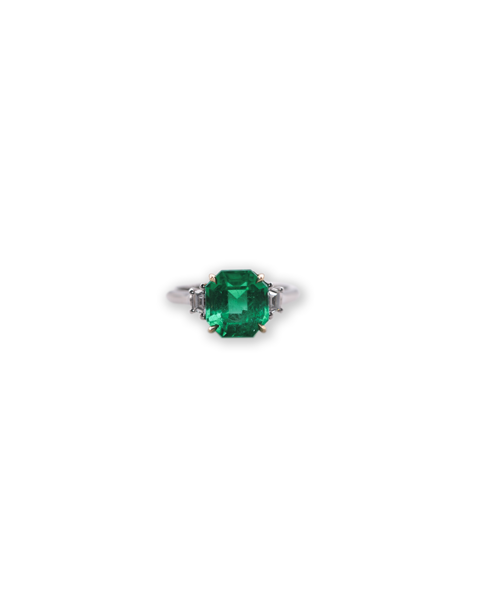 Classic three stone emerald ring