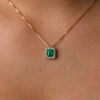 0.96 ct Emerald pendant with diamond halo