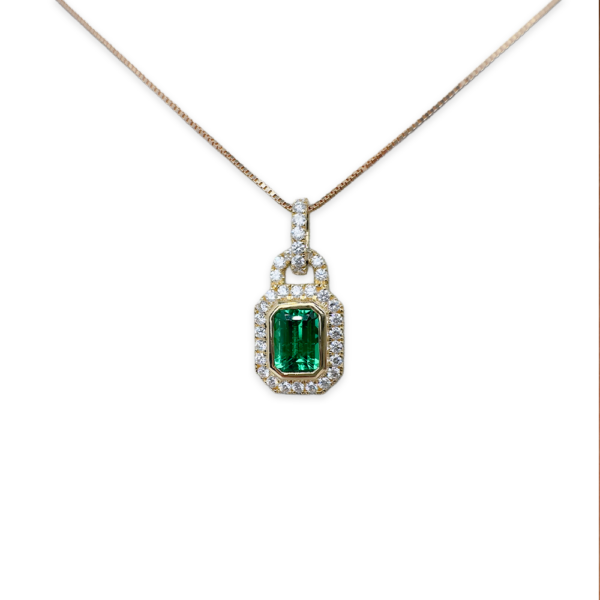 0.81 Emerald Charm with diamond detailing