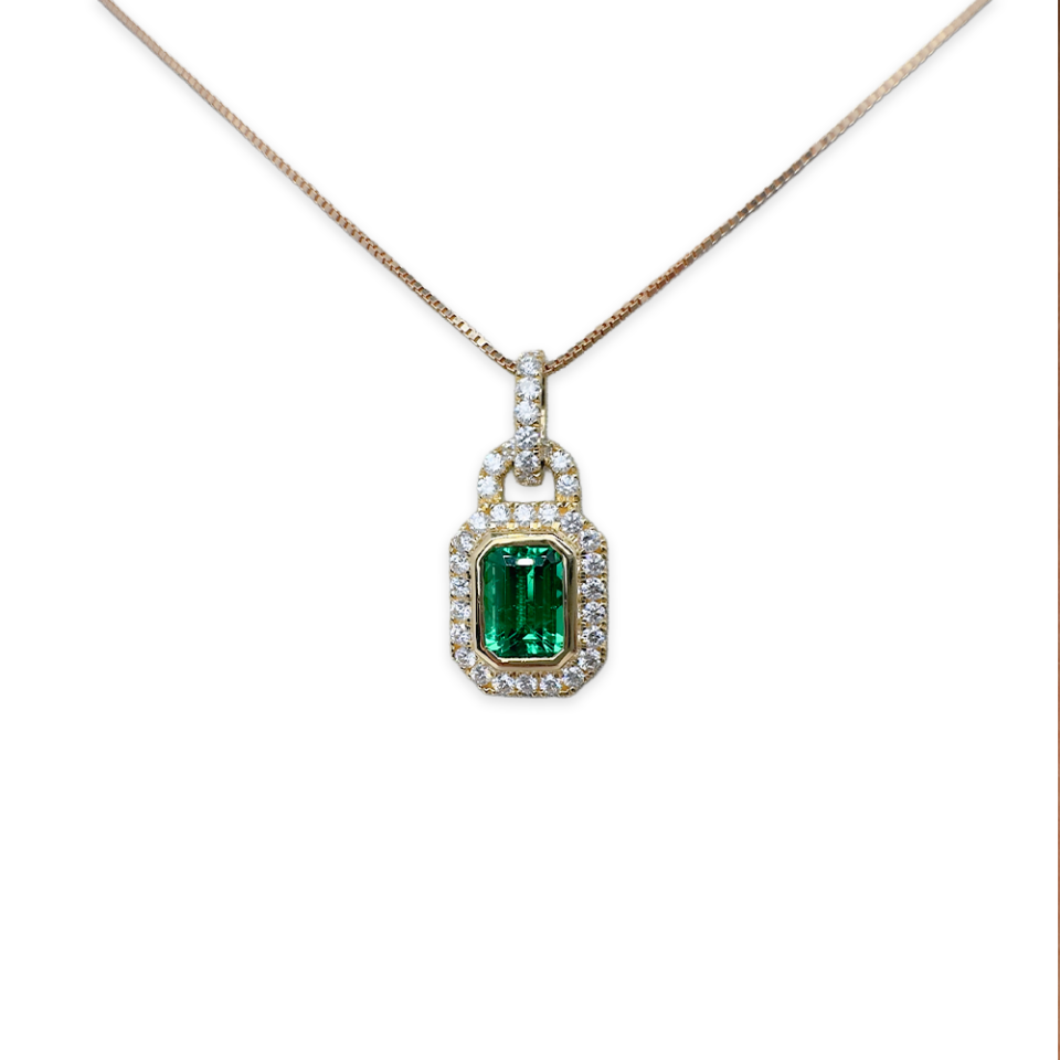 0.81 Emerald Charm with diamond detailing