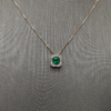 0.81 Emerald pendant with diamond halo
