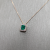 0.96 ct Emerald pendant with diamond halo
