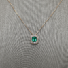 0.96 ct Emerald pendant with diamond halo