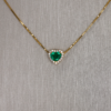 1.70 ct Heart Shaped Emerald pendant with diamond halo