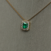 0.51 ct Emerald pendant with diamond halo