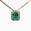 0.51 ct Emerald pendant with diamond halo