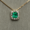 0.51 ct Emerald pendant with diamond halo